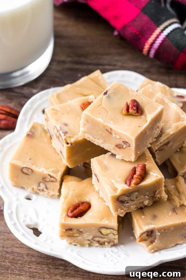 A plate of easy, creamy homemade butter pecan fudge, perfect for holidays.