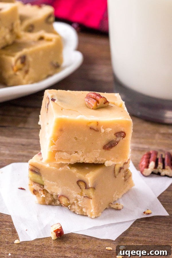 Homemade butter pecan fudge, extra creamy and rich, with visible toasted pecans.