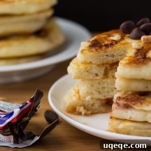 Super fluffy, diner-style pancakes filled with Snickers bars. Because clearly - you can't go wrong with pancakes and your favorite candy bar.
