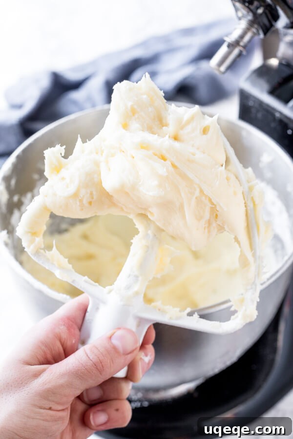Velvety Cream Cheese Frosting 4 A beater with cream cheese frosting that's extra thick and creamy.