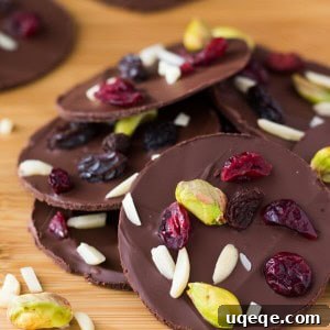 Decadent Dark Chocolate Fruit and Nut Clusters 4 Dark Chocolate Fruit & Nut Clusters with pistachios, almonds, dried cranberries and raisins. Ready in minutes and so pretty, they make a great gift too! www.justsotasty.com