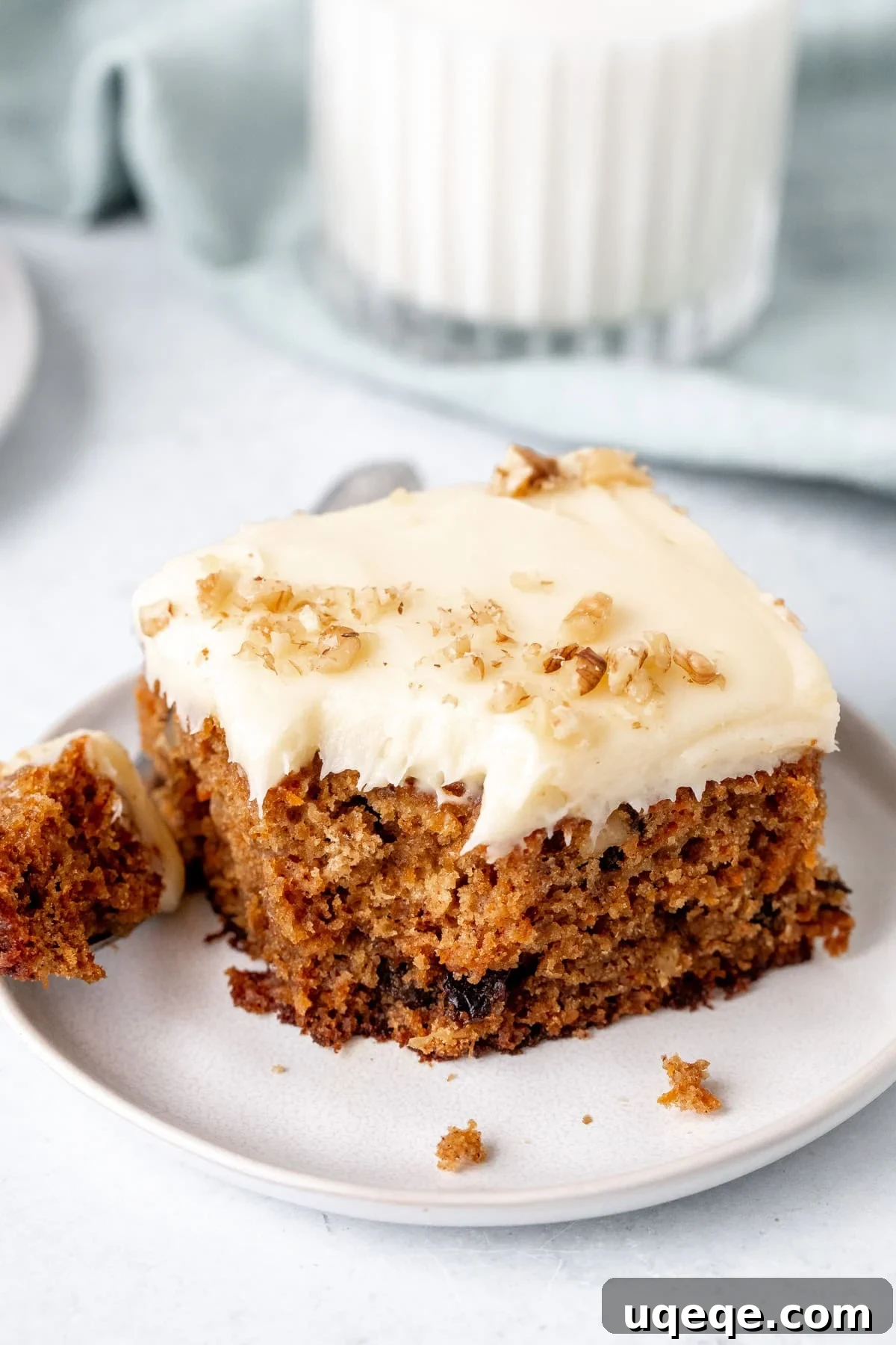 Decadent Moist Carrot Cake 3 Slice of carrot cake sheet cake with bite taken out