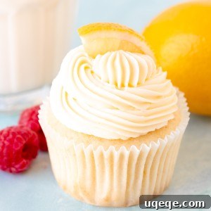 Lemon cupcake with lemon frosting with glass of milk
