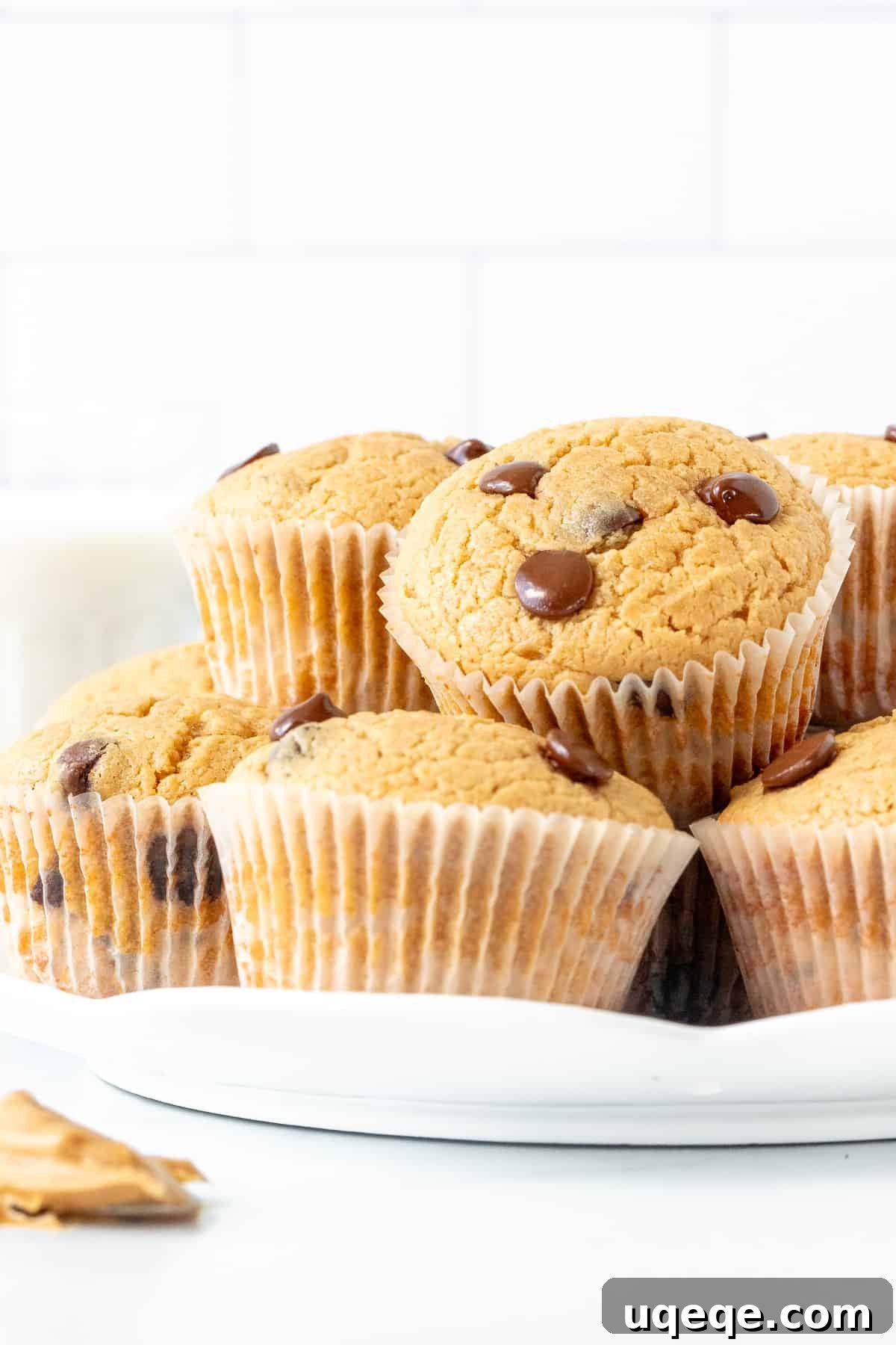 Irresistible Peanut Butter Muffins 3 Plate of freshly baked peanut butter muffins, golden brown and tempting