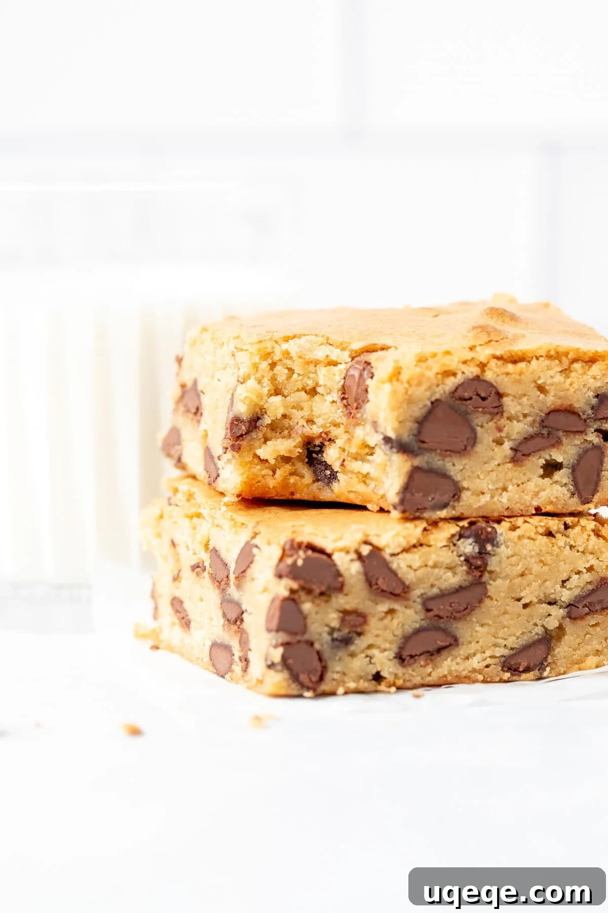Ultimate Chewy Chocolate Chip Bars 6 A freshly baked pan of golden-brown chocolate chip cookie bars, still warm from the oven, with perfectly melted chocolate chips peeking through.
