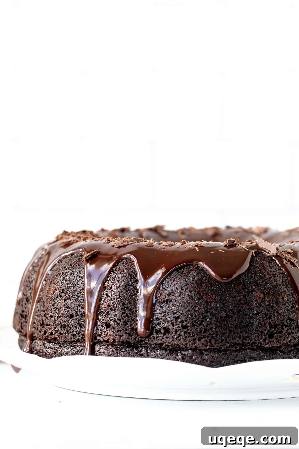 Decadent Chocolate Bundt Delight 8 A rich chocolate bundt cake beautifully adorned with a generous drizzle of chocolate ganache, creating an elegant and irresistible presentation.