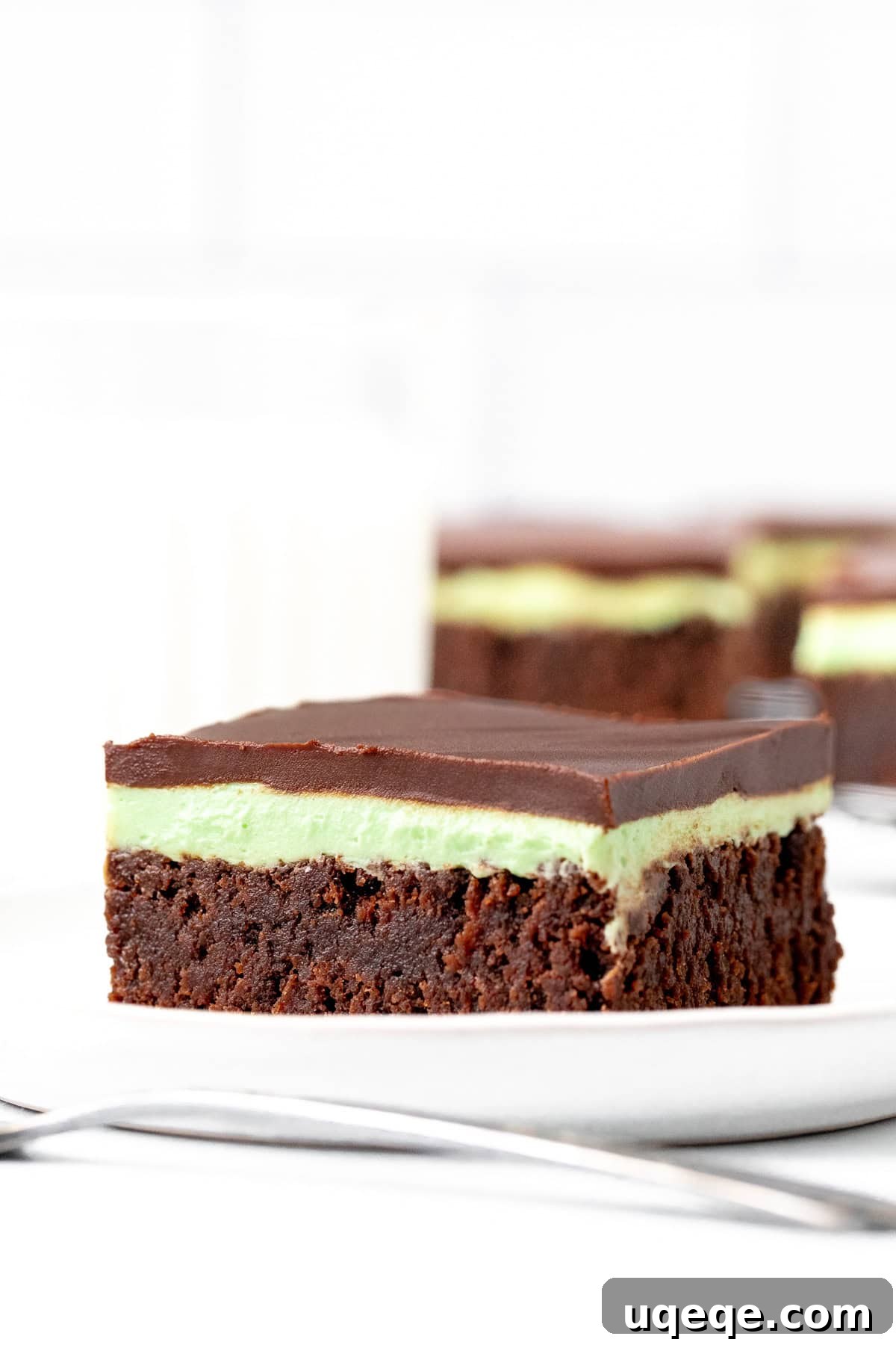 Decadent Mint Swirl Brownies 2 Mint brownie on a plate showcasing all three layers