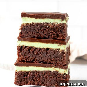 Three mint brownies, stacked one on top of each other