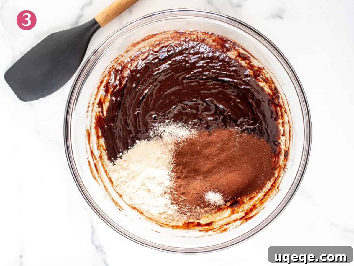 Slutty Brownies: Perfectly Fudgy and Deliciously Homemade 8 A bowl of rich, dark brownie batter, perfectly mixed and ready for baking.