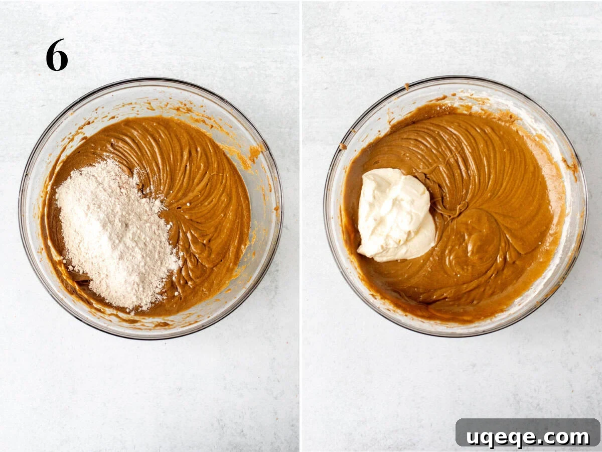 Molasses Spiced Bundt Bliss 6 Partially mixed gingerbread bundt cake batter, showcasing the creamy texture after the initial dry ingredient and sour cream additions, before the final stages of mixing.