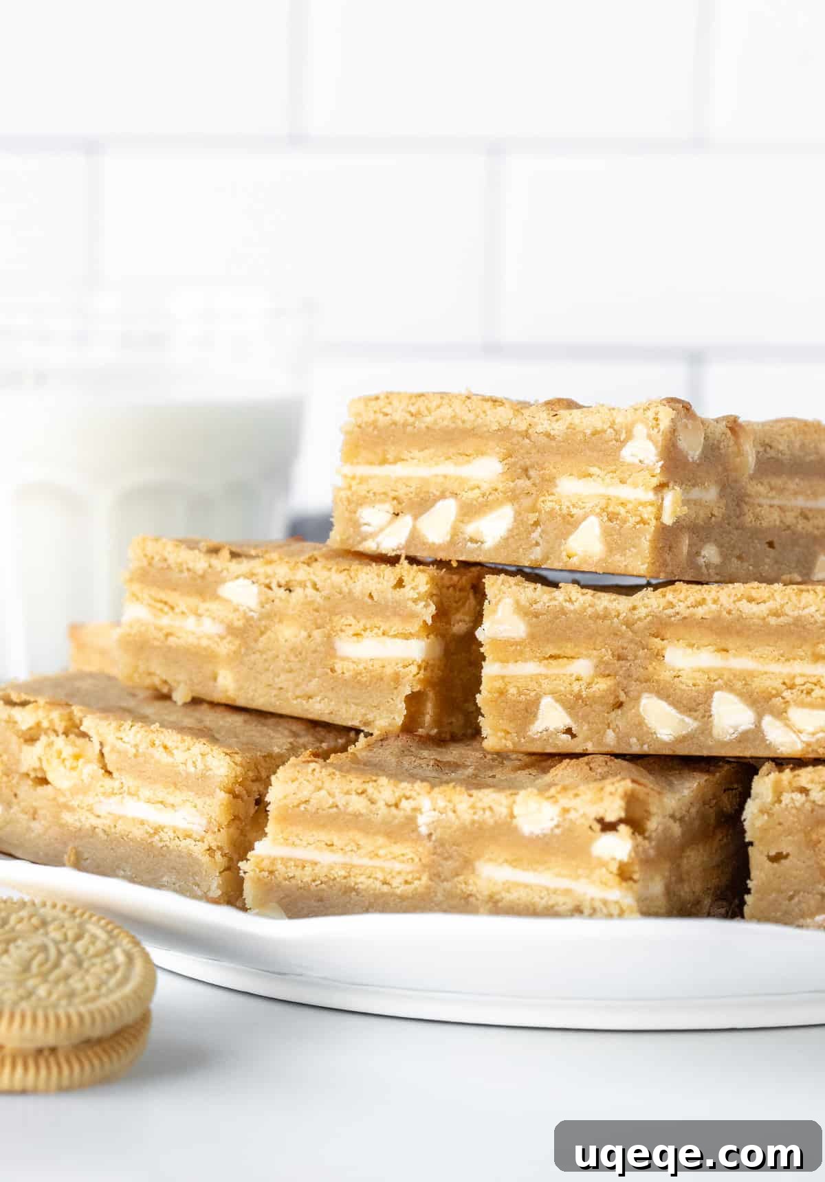 Sunshine Golden Oreo Bars 3 Plate of golden Oreo blondies, stacked on top of each other.