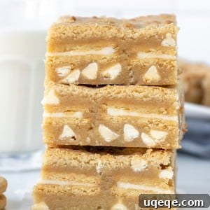 Sunshine Golden Oreo Bars 5 Stack of three golden Oreo brownies with glass of milk