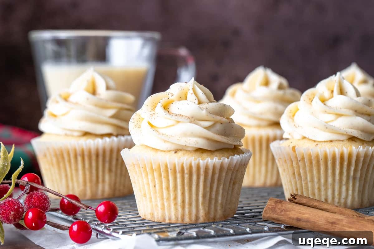 Festive Eggnog Cupcakes 3 Eggnog cupcakes on wire rack