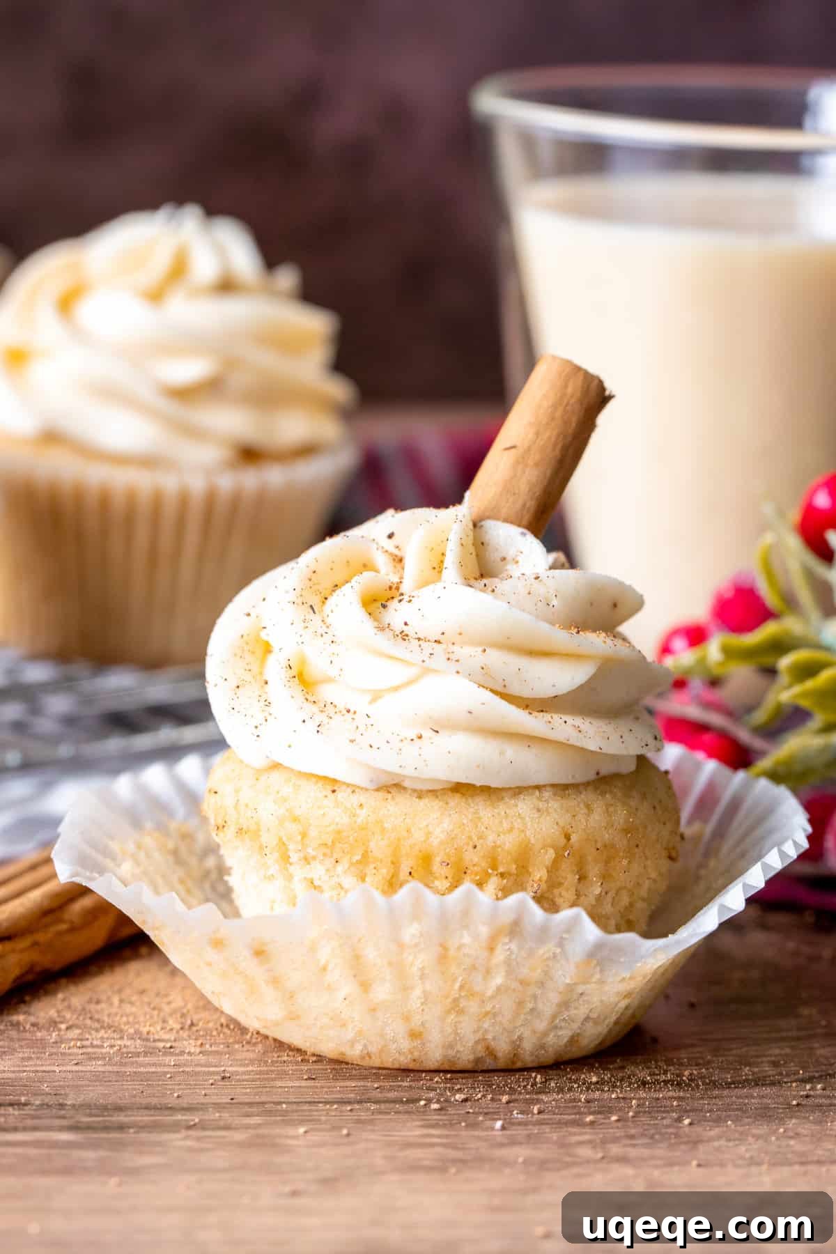 Festive Eggnog Cupcakes 4 Frosted cupcake with cupcake peeled back