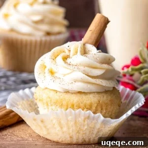 Eggnog cupcake with a glass of eggnog