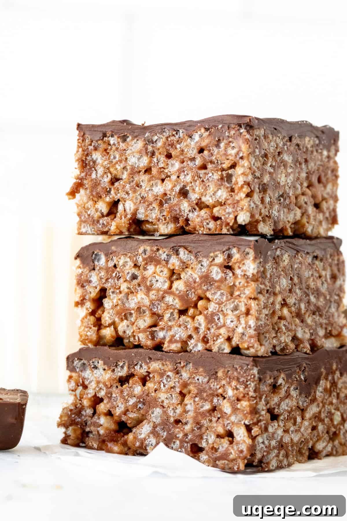 Irresistible Mars Bar Squares 3 Two Mars bar squares with a shiny chocolate topping, stacked enticingly