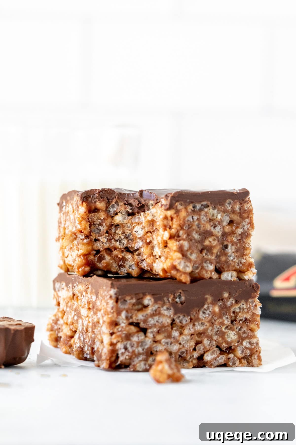 Irresistible Mars Bar Squares 6 Two Mars Bar Squares stacked, with the top square showing a bite taken out, revealing the gooey interior
