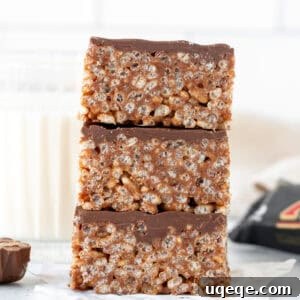 Stack of three Mars Bar Slice squares, one on top of another, showing their rich texture.