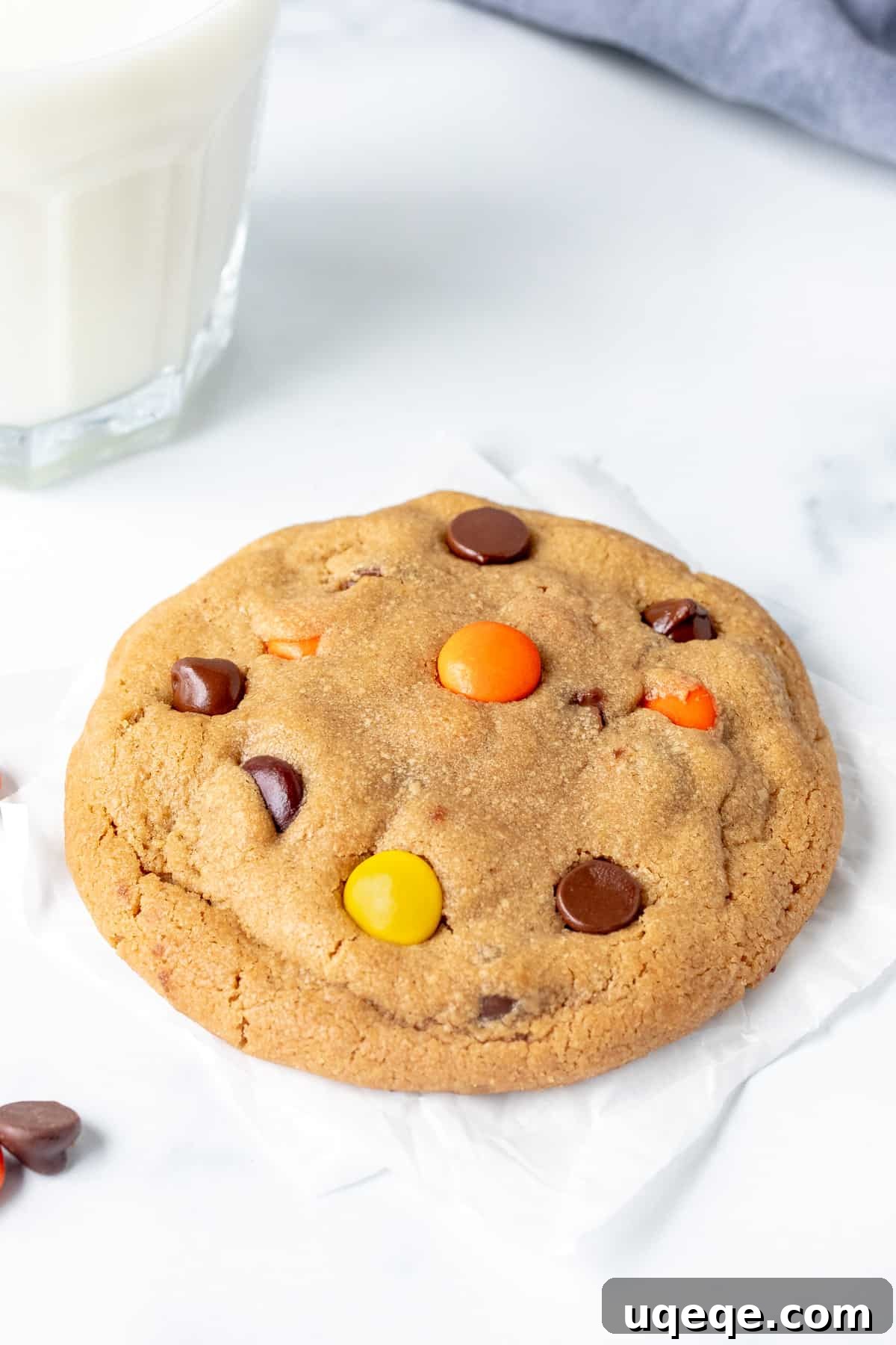 Reese's Pieces Peanut Butter Cookie Perfection 6 Bakery-style peanut butter cookie served with a glass of milk, highlighting its thick and appealing appearance.