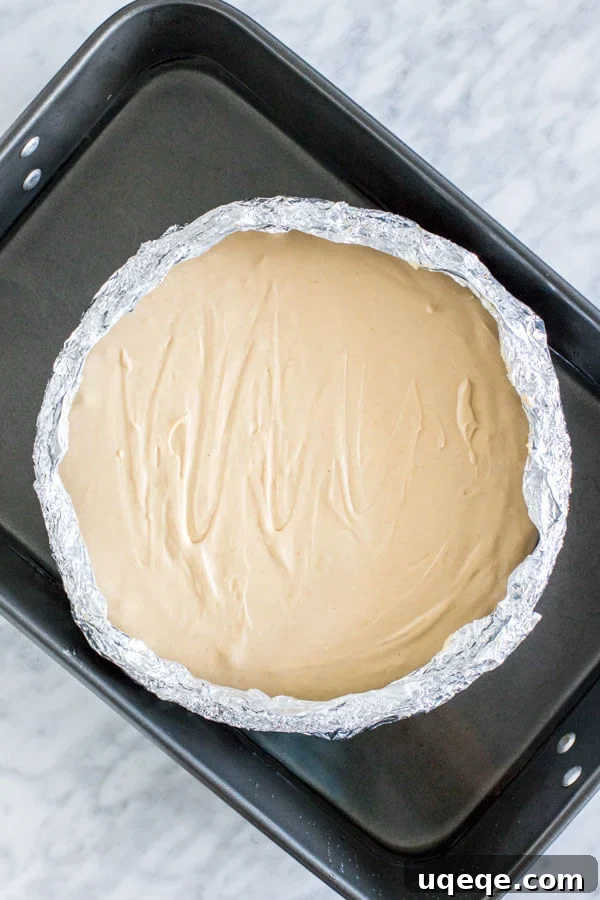 Unbaked cheesecake, in water bath. 