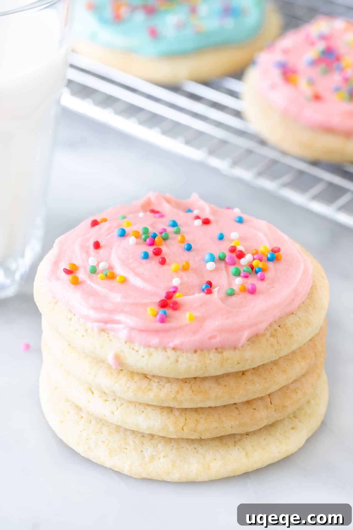Pillowy Soft Sour Cream Sugar Cookies 4 Stack of sugar cookies with a glass of milk