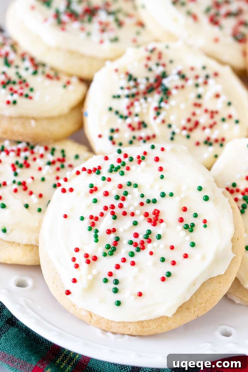 Pillowy Soft Sour Cream Sugar Cookies 6 Plate of thick, soft, sour cream sugar cookies with frosting and sprinkles