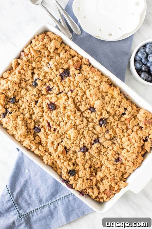 Overnight Blueberry French Toast Bake 3 9x13 inch pan of blueberry french toast casserole with cinnamon streusel topping.
