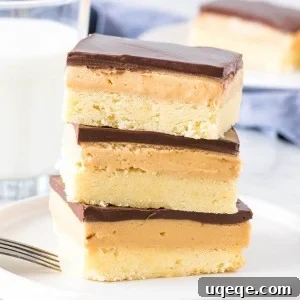 Stack of 3 peanut butter shortbread bars with a glass of milk.