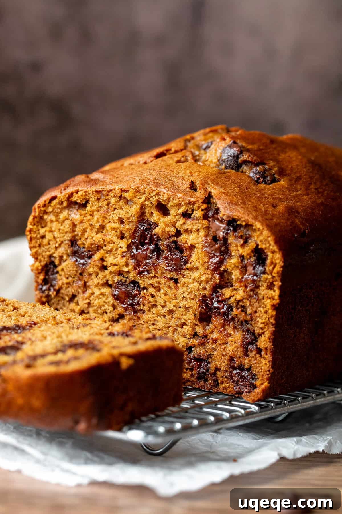Spiced Pumpkin Chocolate Chip Bread 3 A freshly baked Pumpkin Chocolate Chip Loaf, cut in half to reveal its moist, tender crumb and generous chocolate chips, a perfect slice for autumn.