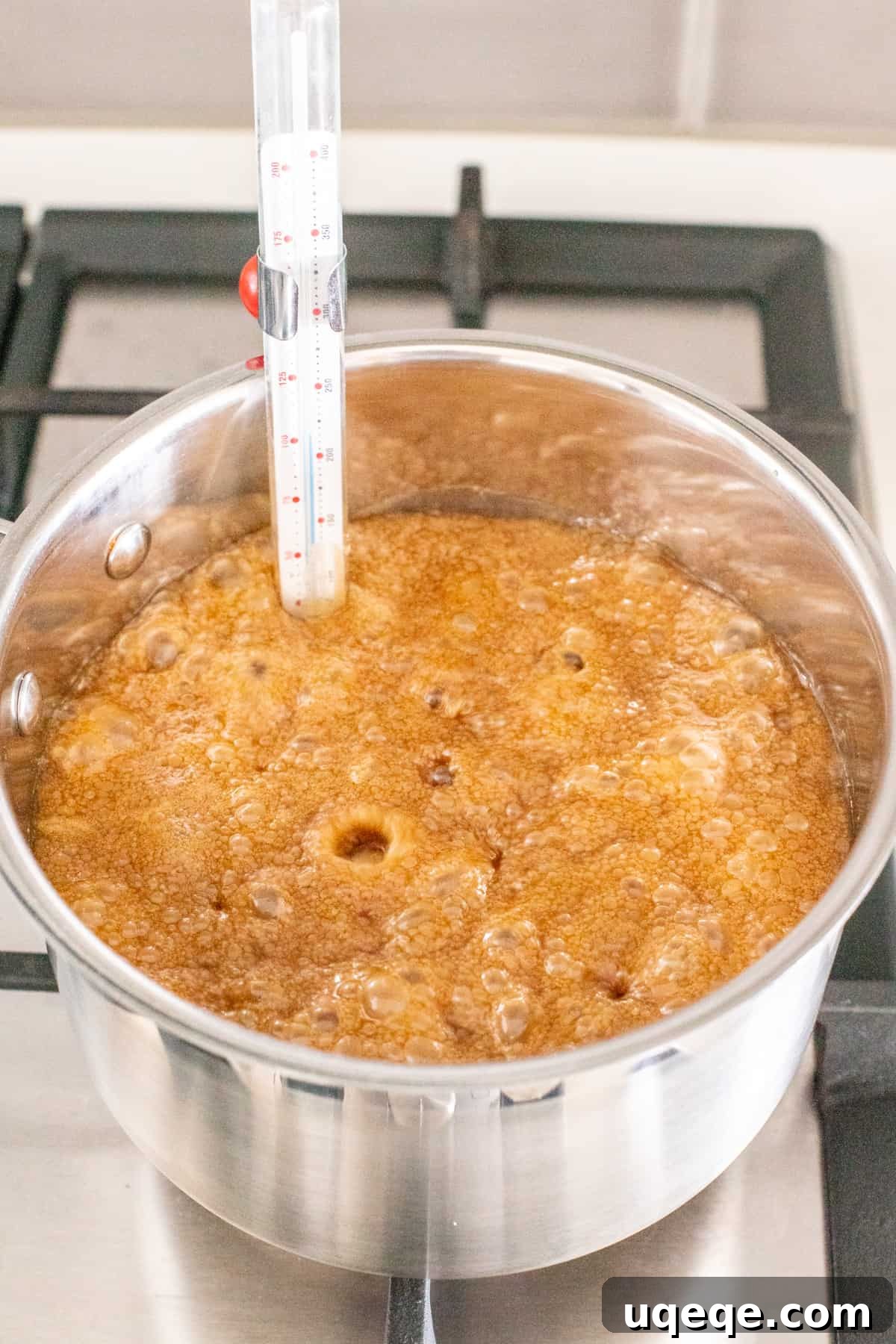 Sweet Brown Sugar Bliss 3 A large pot on a stovetop, filled with a creamy, amber-colored mixture of boiling sugar and butter, actively bubbling as it cooks.