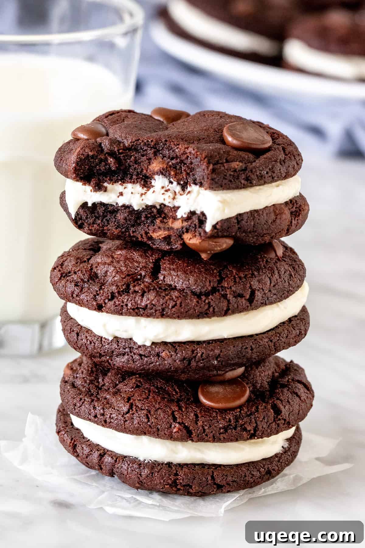 Decadent Chocolate Cremes 4 Stack of three chocolate cookies with vanilla frosting.