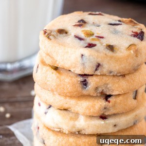 Stack of slice and bake Cranberry Pistachio Shortbread cookies, showcasing the recipe.
