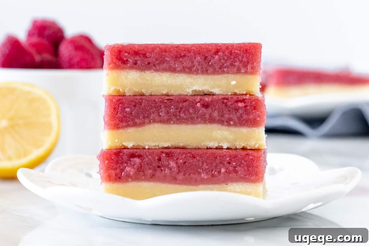 Sunshine Lemon Raspberry Bars 7 Stack of 3 lemon raspberry bars, ready to be enjoyed.