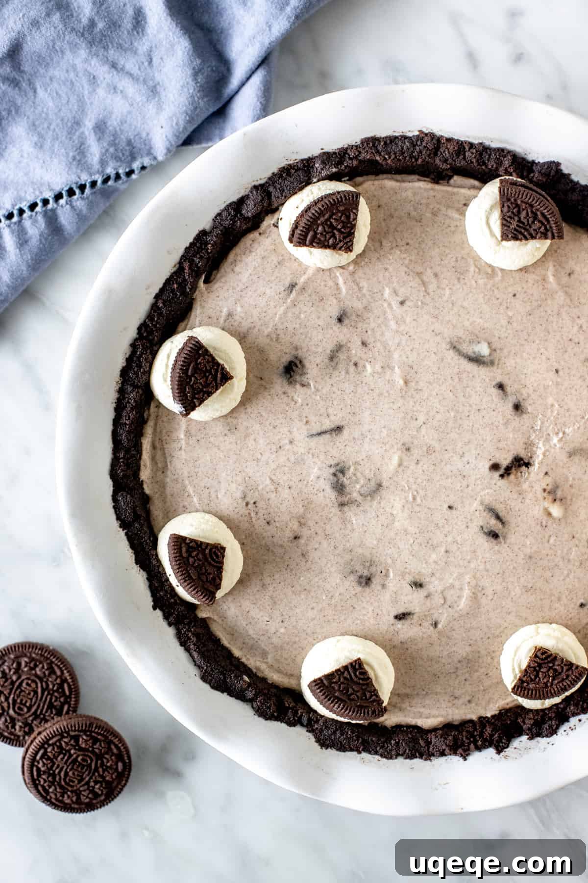 Ultimate Oreo Indulgence 3 A full cookies and cream pie in a glass pie plate, ready to be chilled.