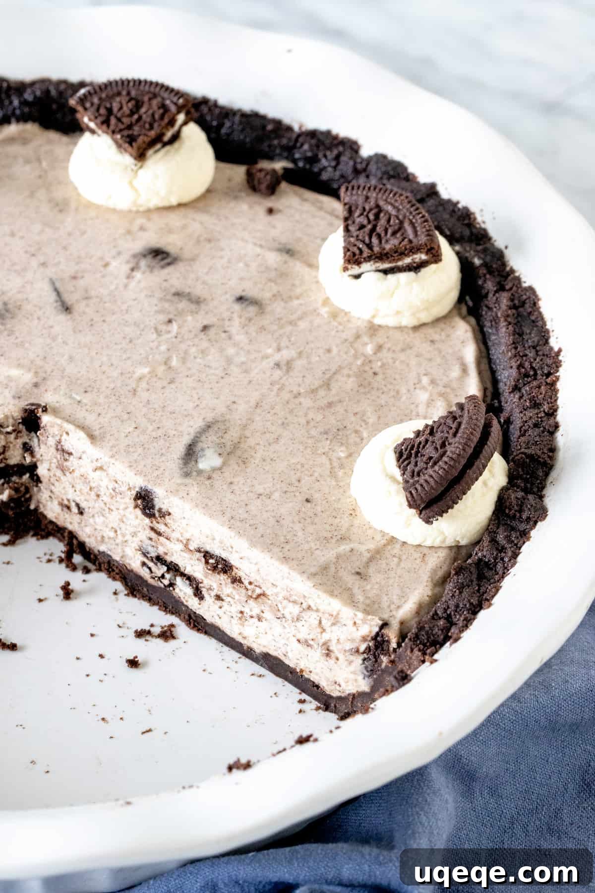 Ultimate Oreo Indulgence 6 A full, uncut Oreo cream pie in a pie plate, chilled and ready for serving.