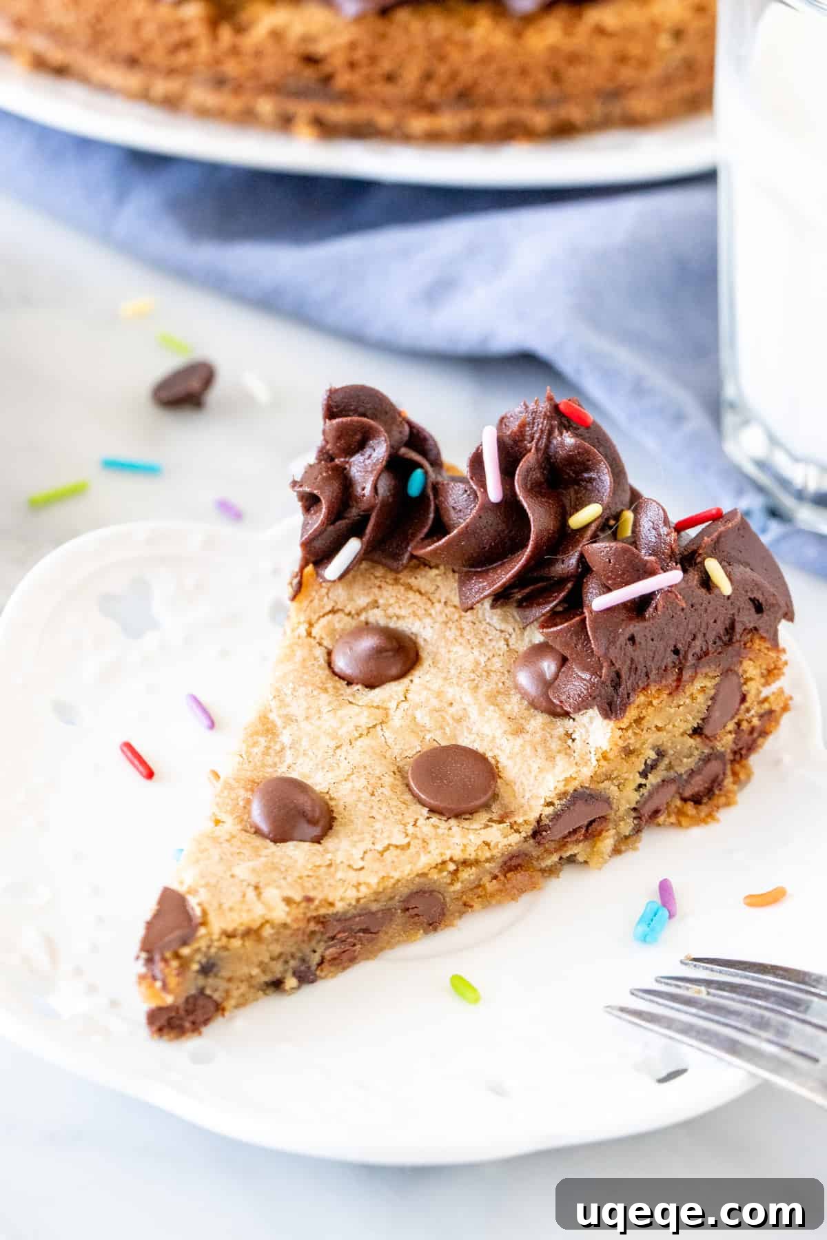 Ultimate Chocolate Chip Cookie Cake 2 Slice of a perfectly baked chocolate chip cookie cake, showcasing its soft interior and abundant chocolate chips.