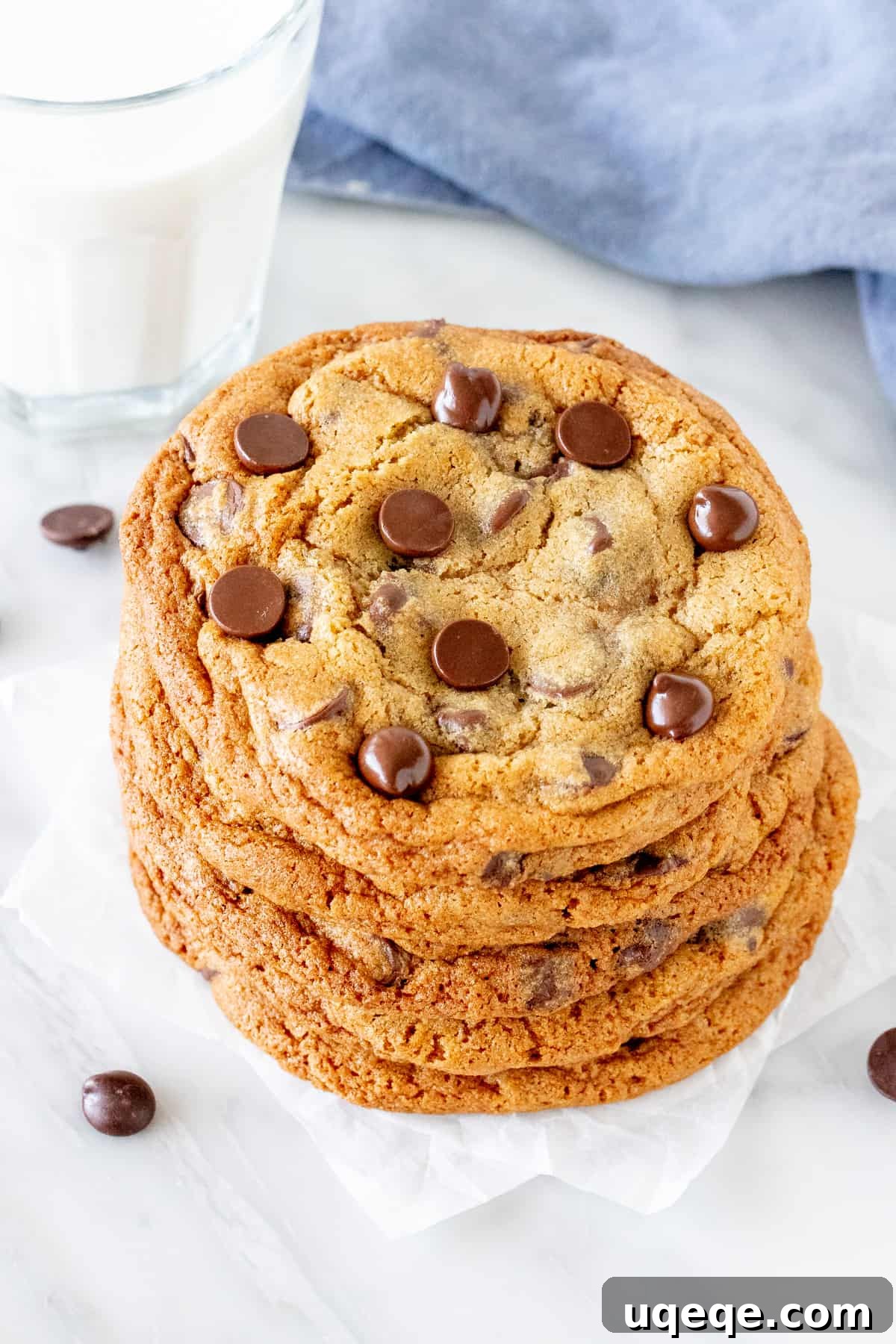 Signature Bakery Chocolate Chip Delights 5 A stack of golden brown bakery-style chocolate chip cookies, rich with chocolate chips, presented alluringly.