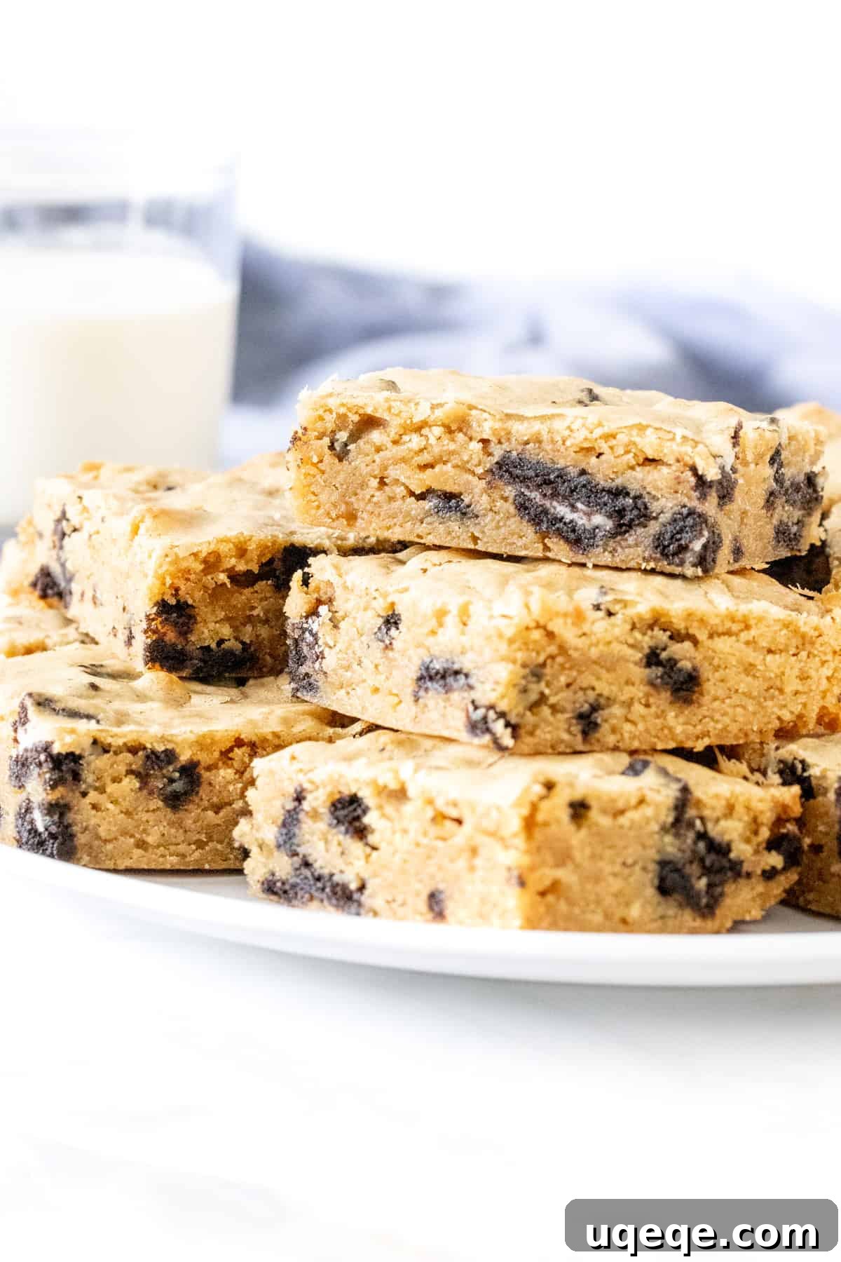 Cookies and Cream Dream Bars 2 Plate of Oreo blondies stacked on top of each other.
