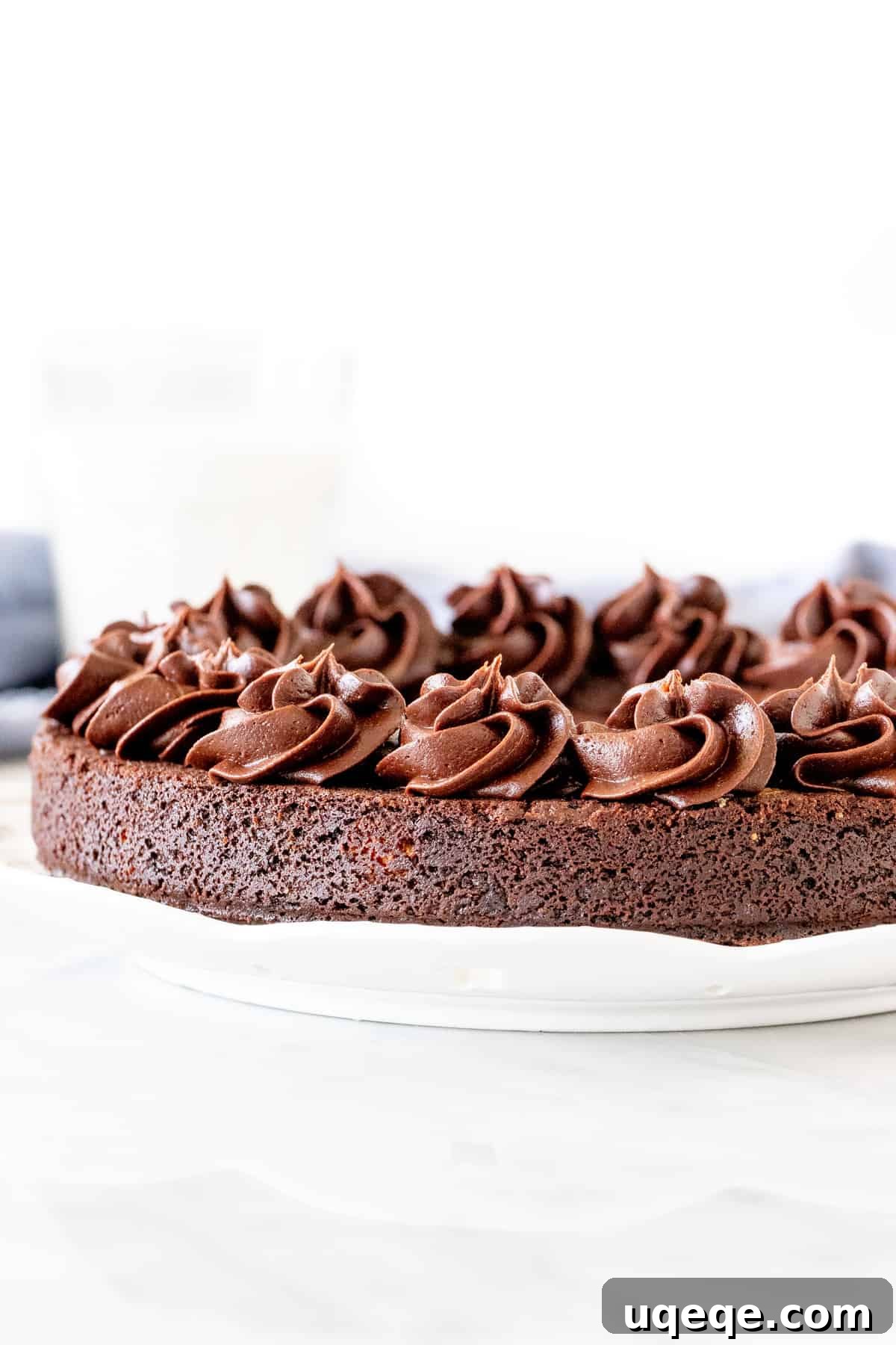 Signature Double Chocolate Cookie Cake 2 Chocolate cookie cake with chocolate frosting piped around the edges, ready for a celebration