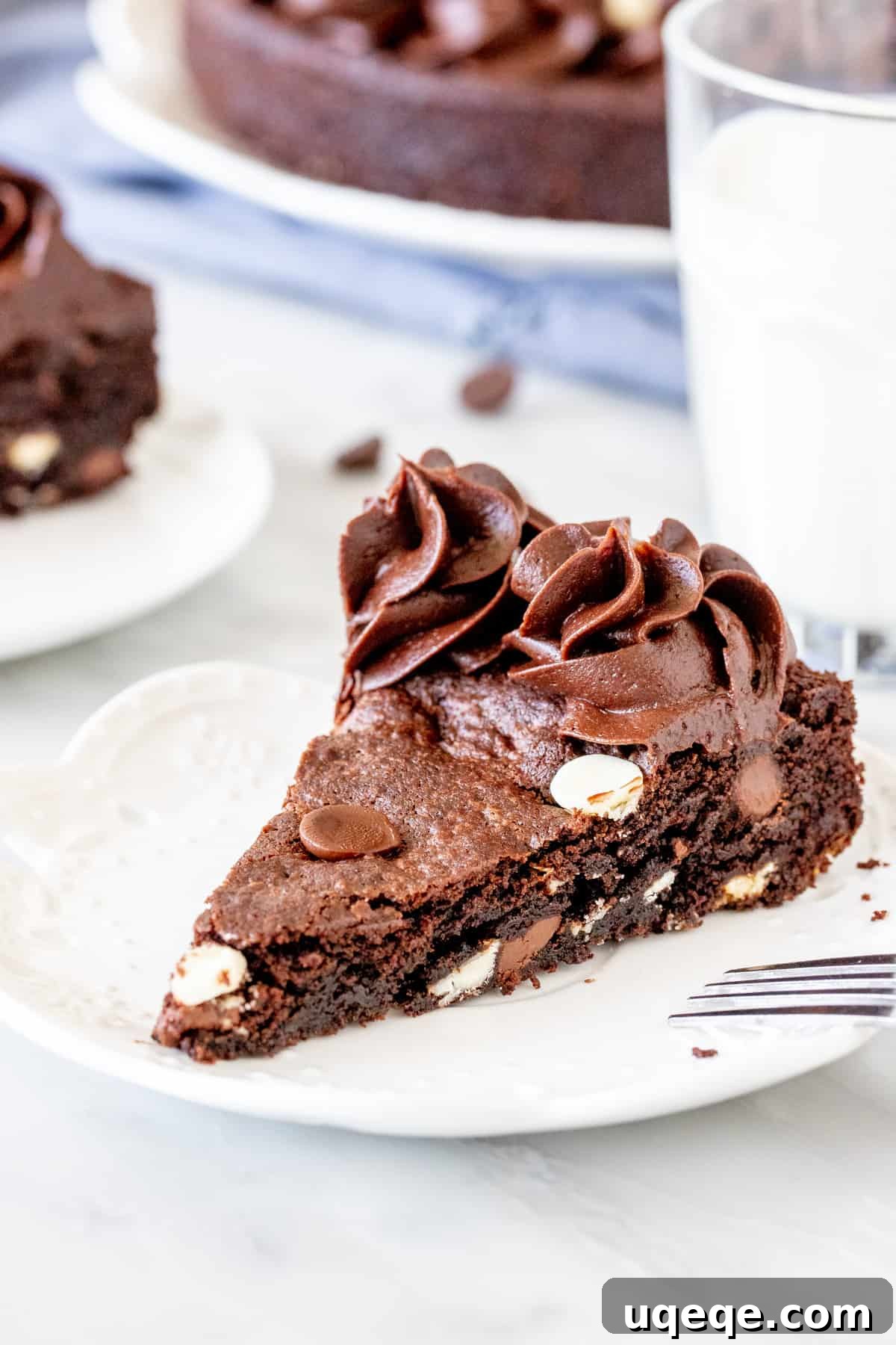 Signature Double Chocolate Cookie Cake 4 A delectable slice of fudgy double chocolate cookie cake with creamy frosting