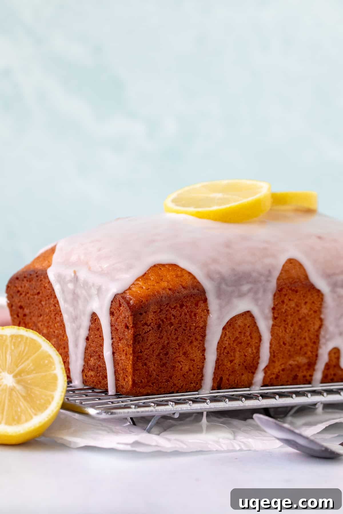 Glazed lemon loaf cooling on a wire rack, ready to be sliced and enjoyed