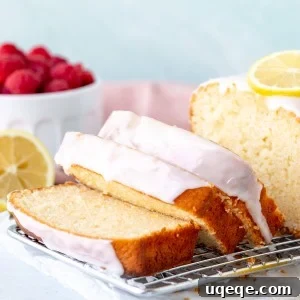 Sliced lemon loaf on a wire cooling rack, ready to serve