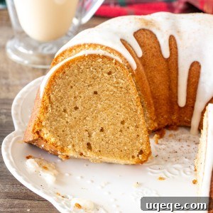 Round eggnog bundt cake with a few slices sliced