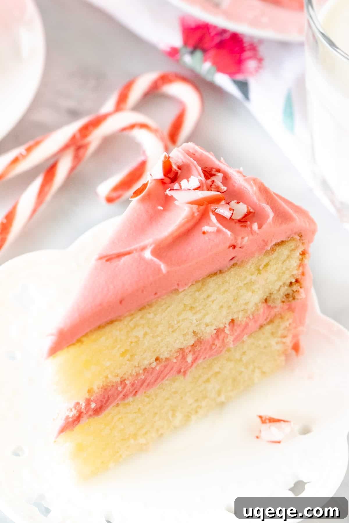 White Chocolate Peppermint Candy Cane Cake 3 Slice of candy cane layer cake with white chocolate peppermint frosting