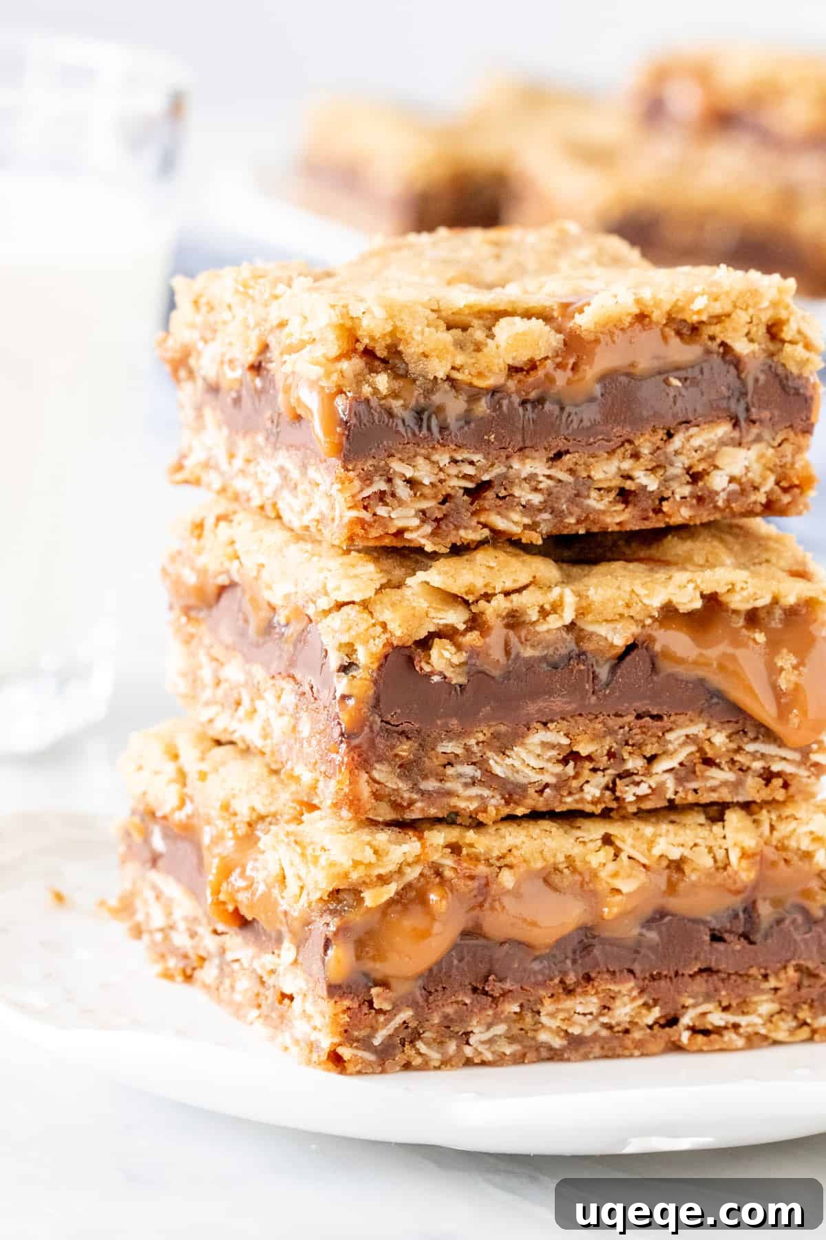 Caramelitas Chewy Caramel Oatmeal Bars 2 Stack of 2 caramel oatmeal bars with a glass of milk