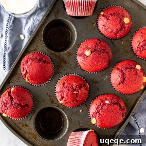 Batch of freshly baked red velvet muffins in a pan, ready to be enjoyed.