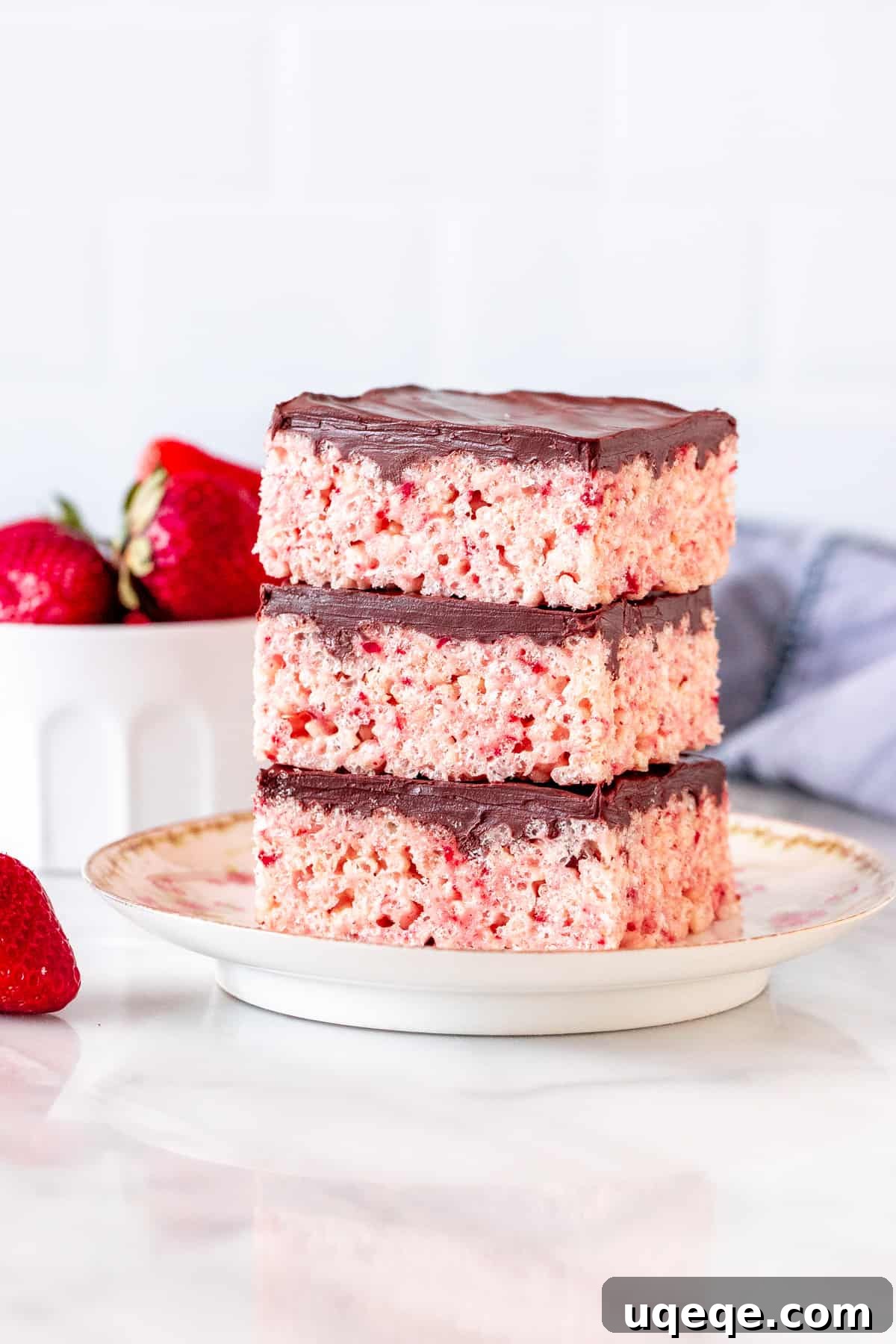 Strawberry Krispie Squares 2 Stack of 3 strawberry rice krispie treats with chocolate topping