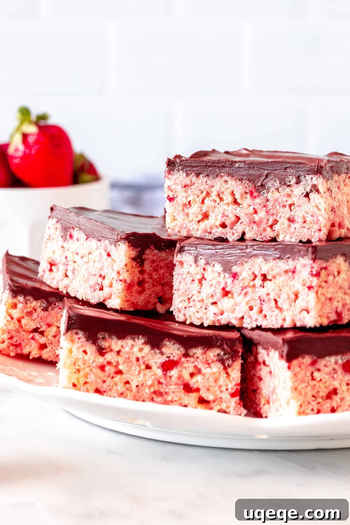 Strawberry Krispie Squares 5 Plate of strawberry cereal treats with chocolate topping