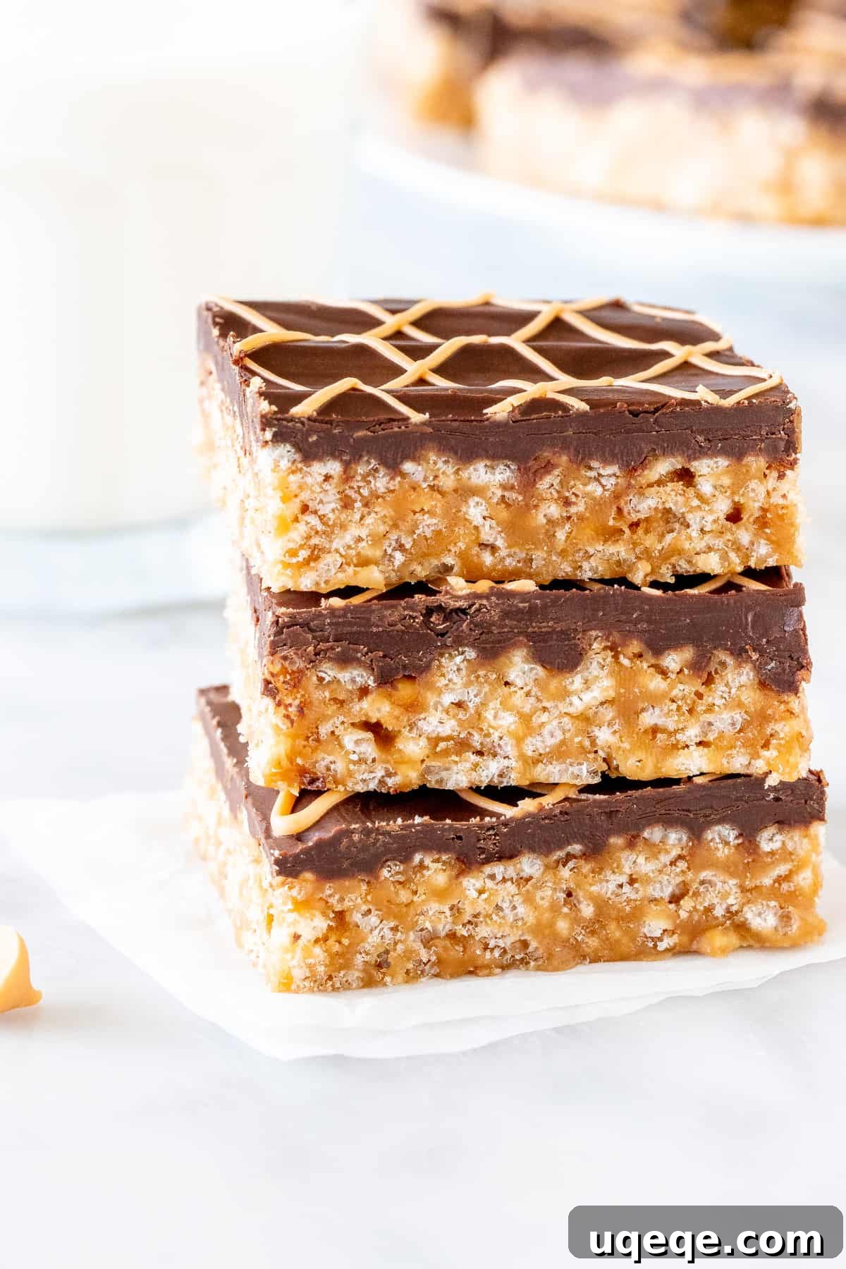 Tiger Bar Golden Butterscotch Crunch 2 Stack of 3 tiger bars, one on top of the other, showcasing the butterscotch base and chocolate topping.