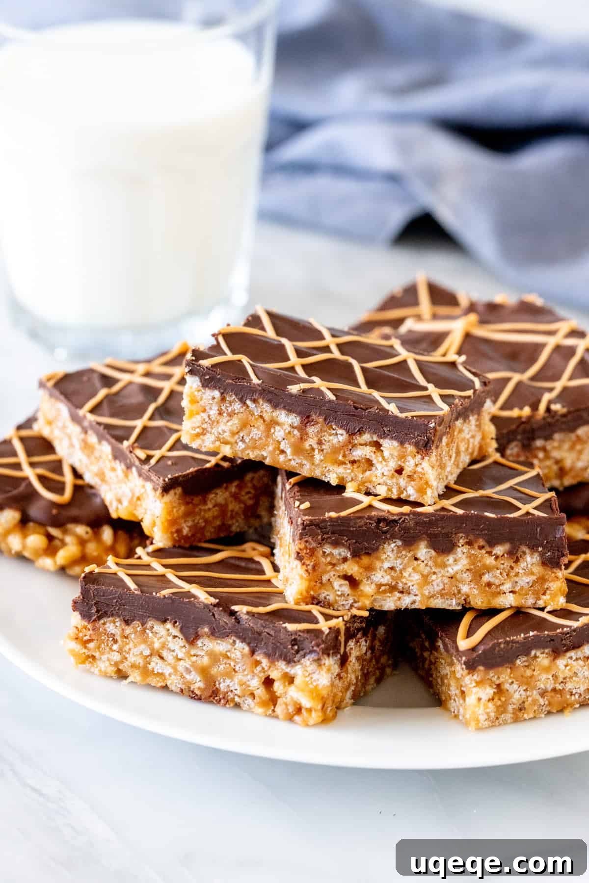 Tiger Bar Golden Butterscotch Crunch 3 Plate of butterscotch Rice Krispie treats with chocolate on top, ready to be served.
